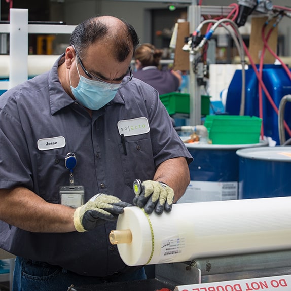 Solecta team member inspecting membranes